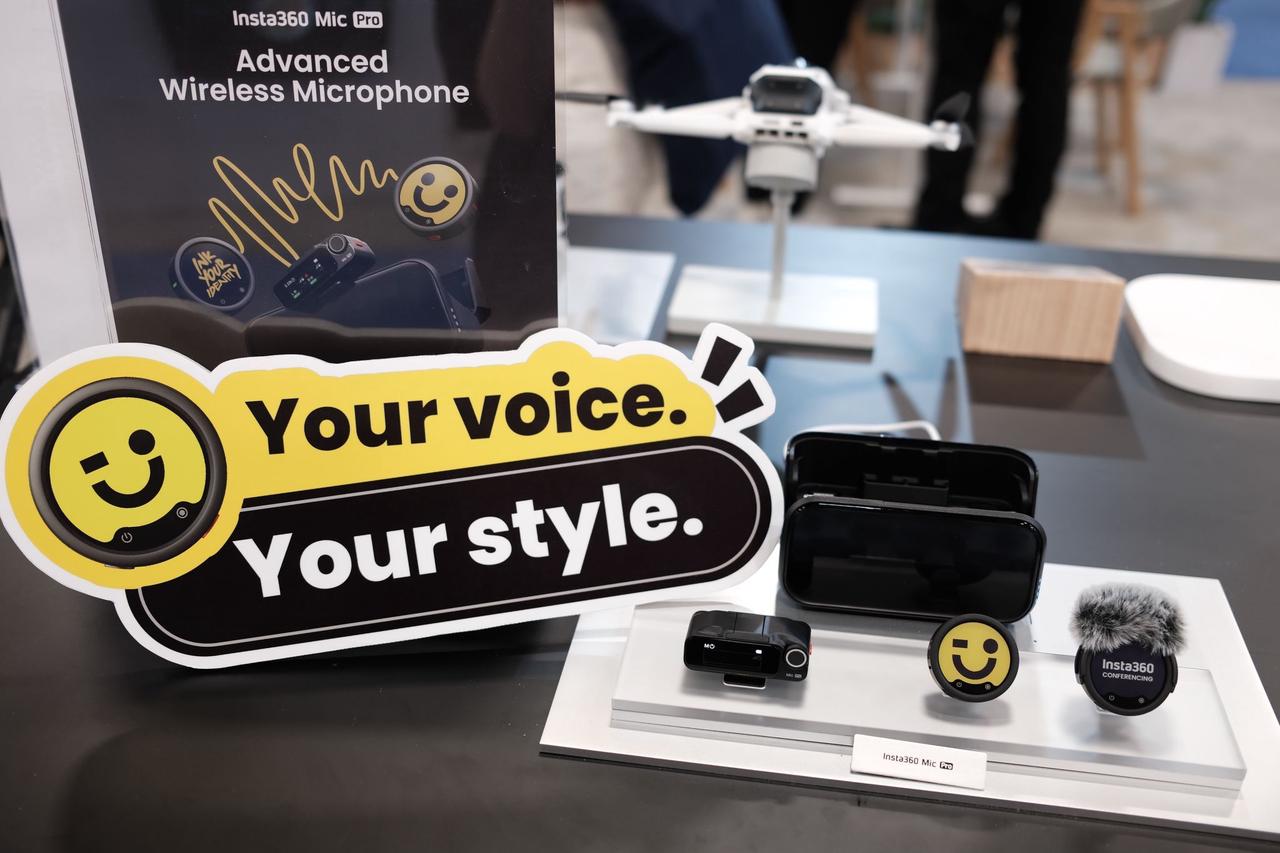 An image of Insta360's new wireless mic, Insta360 Mic Pro, alongside its charging case.